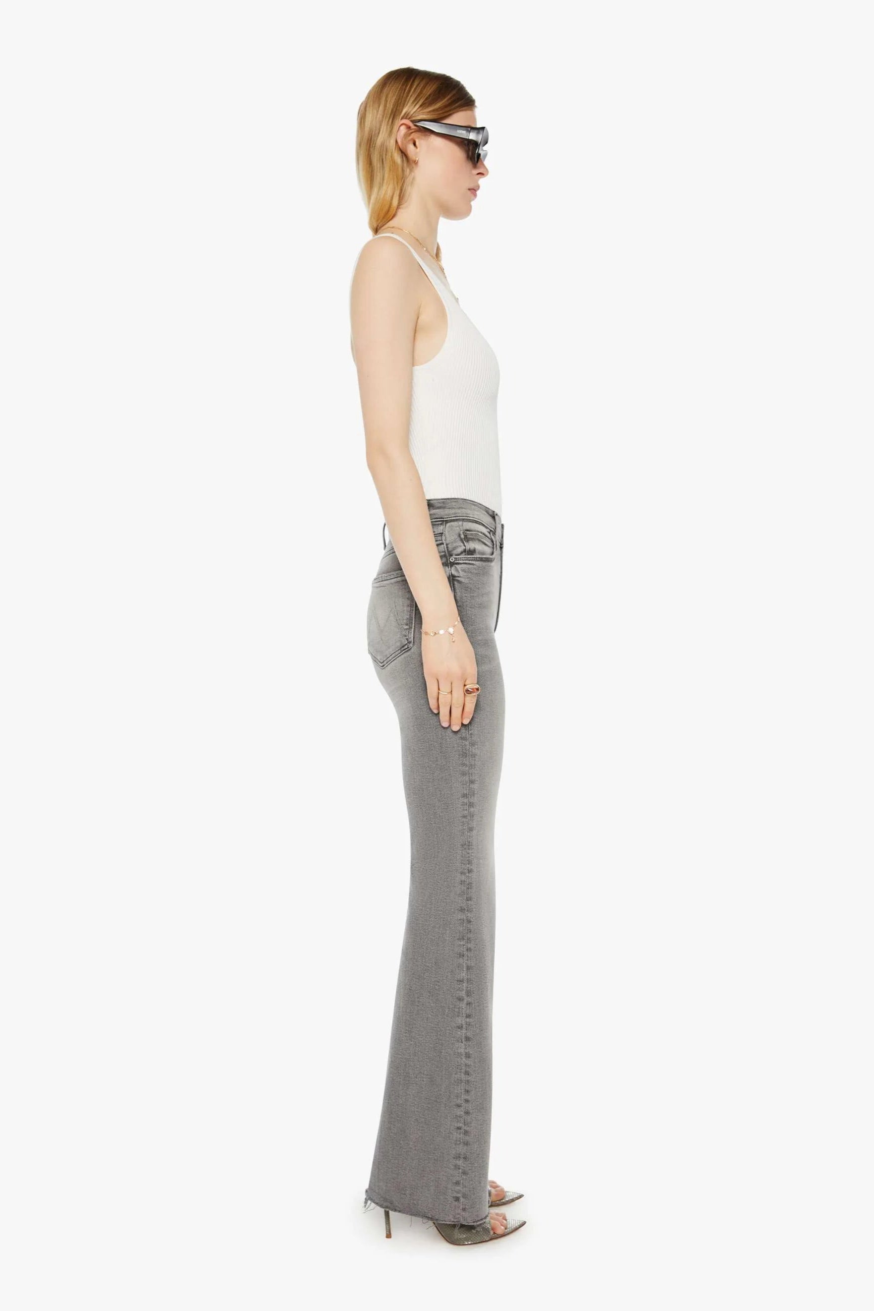 Grey flared stretch denim jeans with frayed edges | Shop Eleanor - Women's Designer Clothing Boutique in Colorado