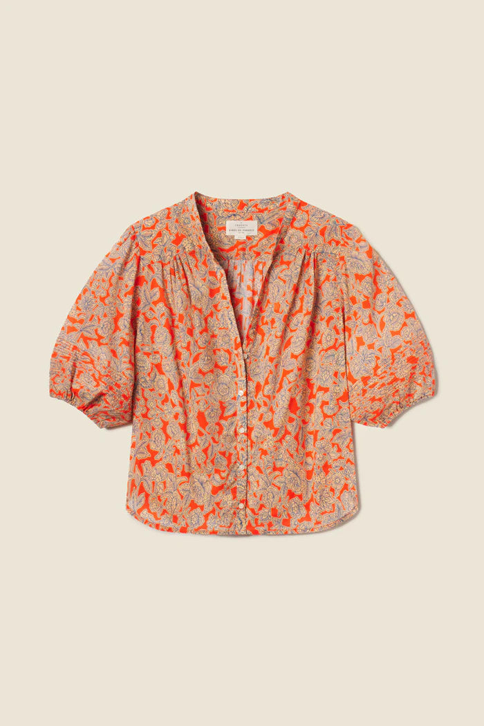 Floral blouse with orange and red pattern that pairs well with mid wash blue denim jeans