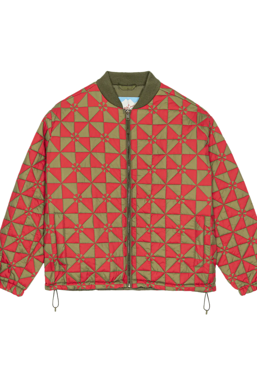 Red and green geometric patterned jacket on a white background