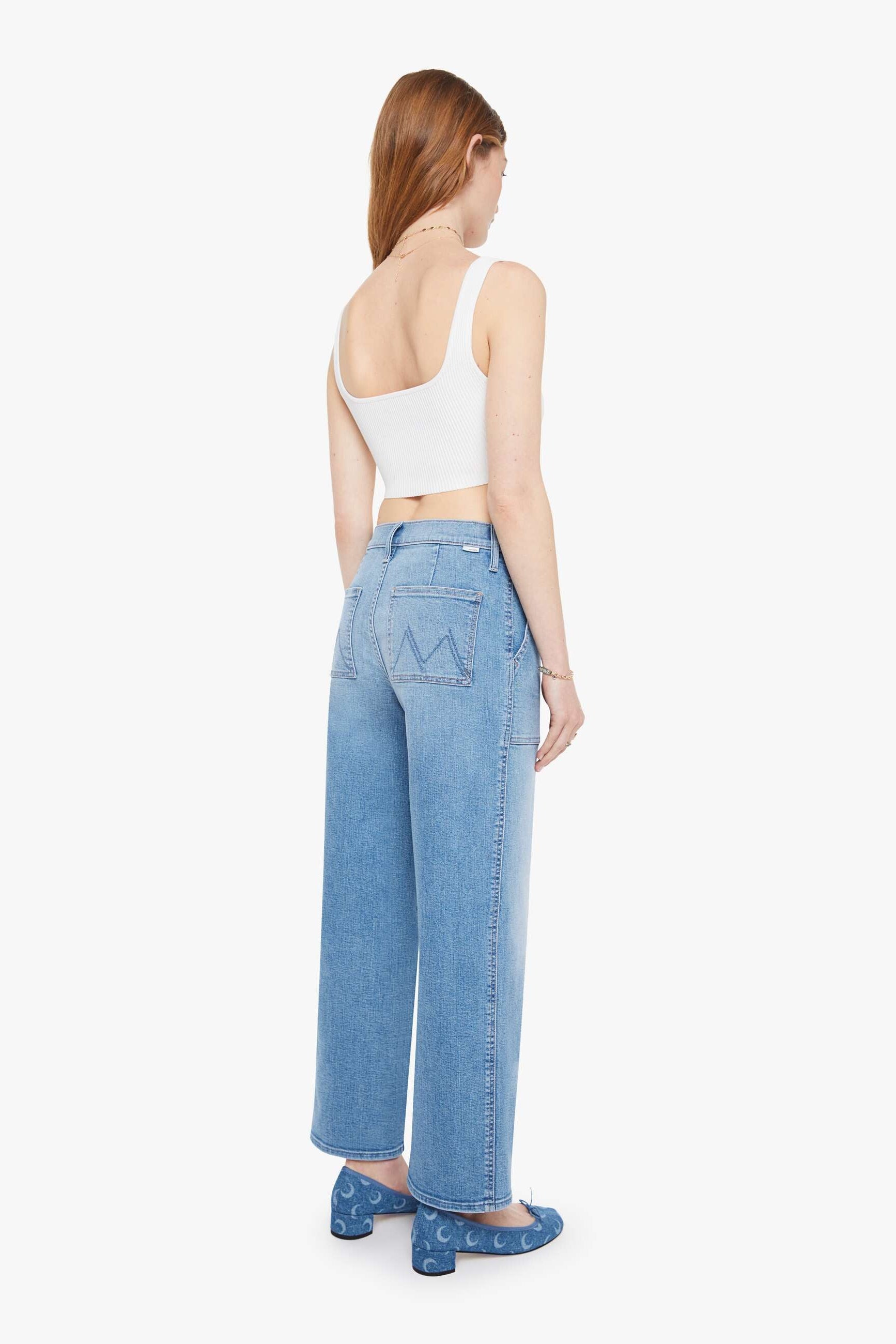 A high-waisted light blue denim jean by Mother | Shop Eleanor - Women's Luxury Apparel near Denver