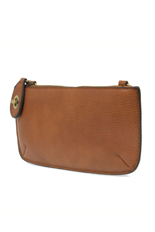 Brown leather clutch bag on a white background