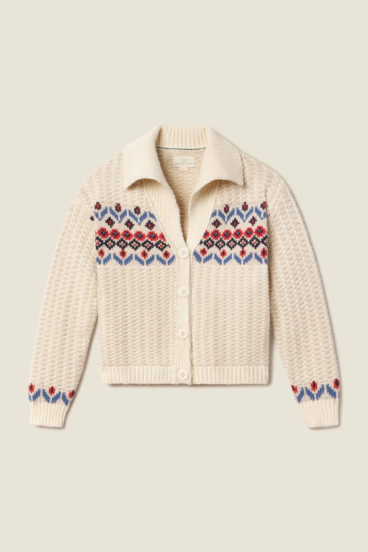 Cream-colored knitted cardigan with colorful red and blue pattern 