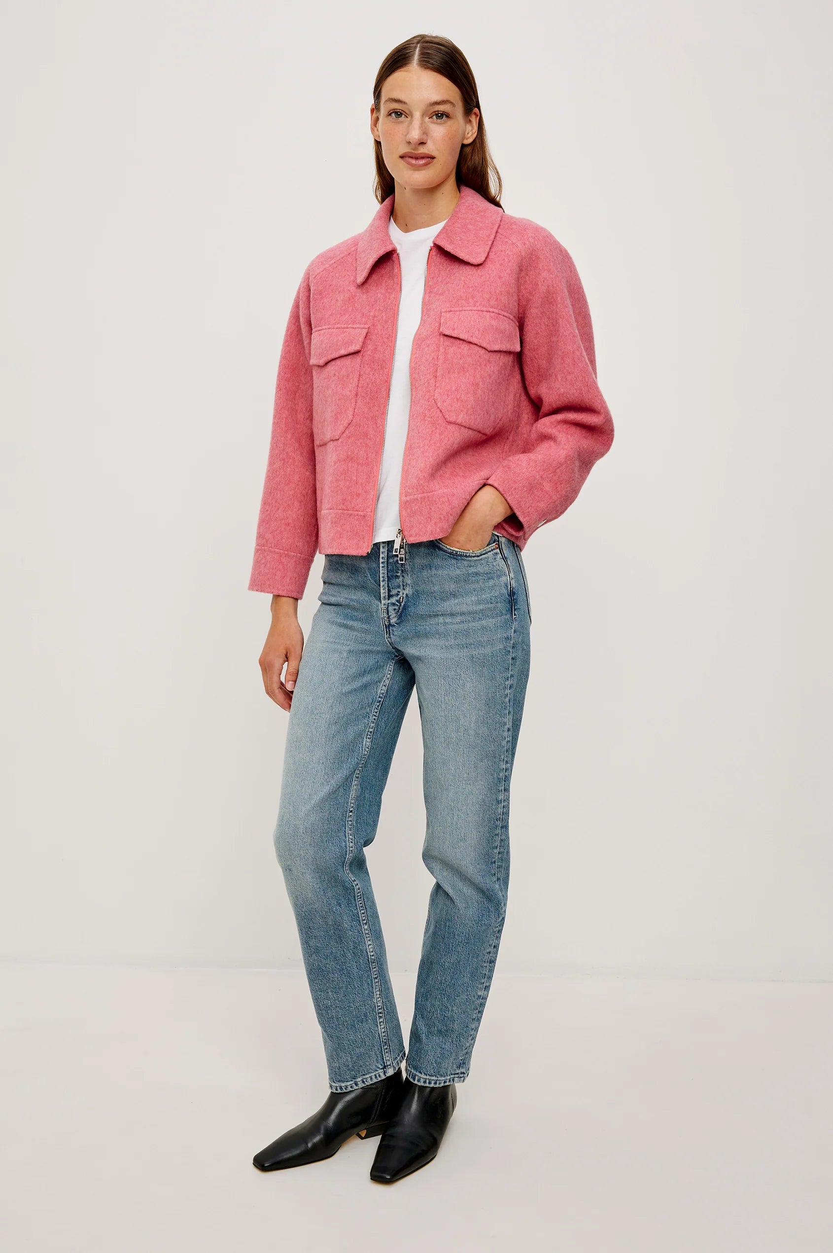 Soft pink collared wool jacket with large patch pocket on the front chest