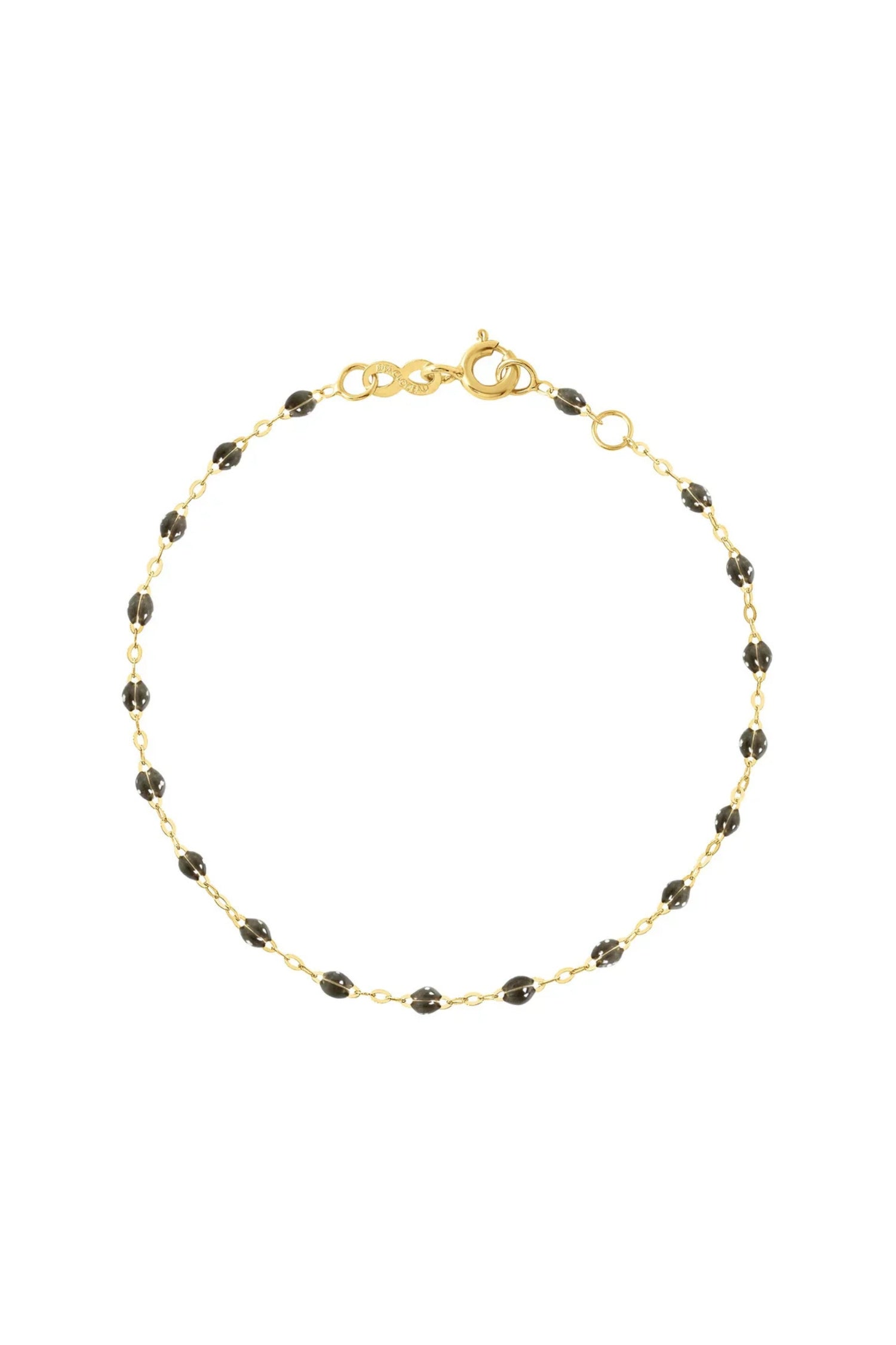 Gold bracelet with black beads